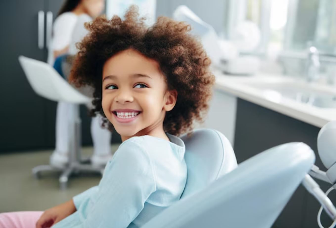 Young patient smiling at the dentist